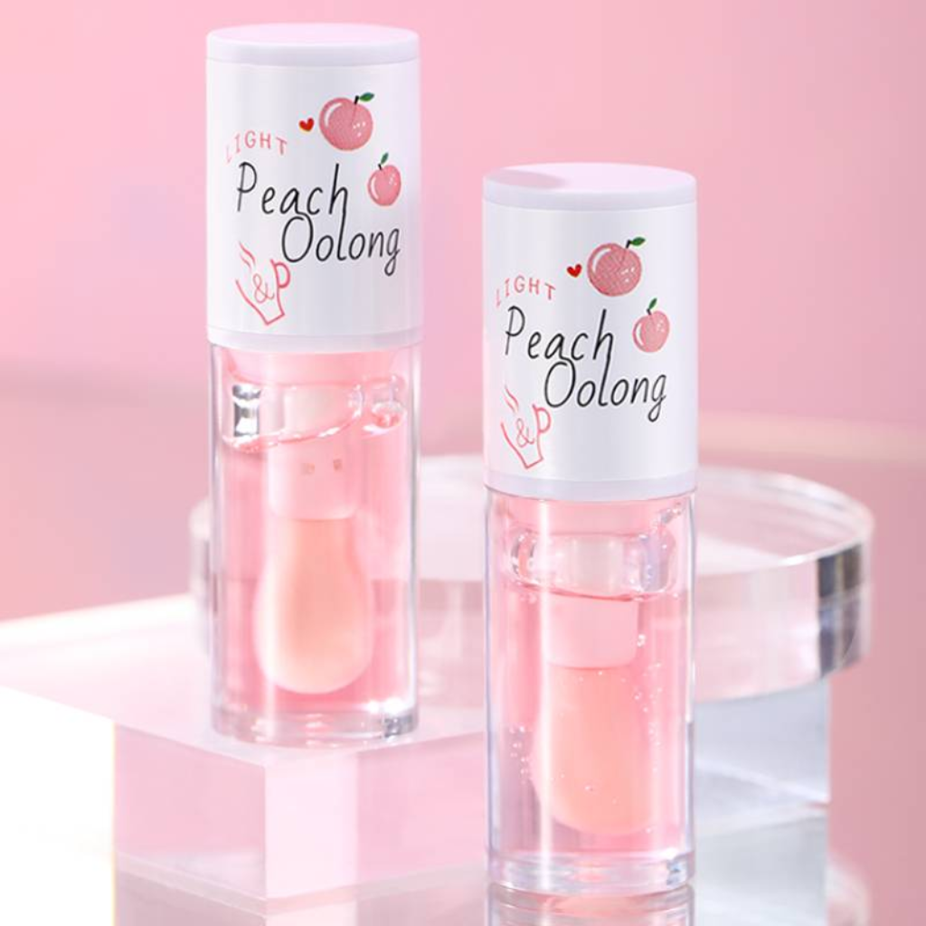 Lip oil infused with nourishing and moisturizing ingredients, including honey and milk to promote supple and resilient lips. Peach